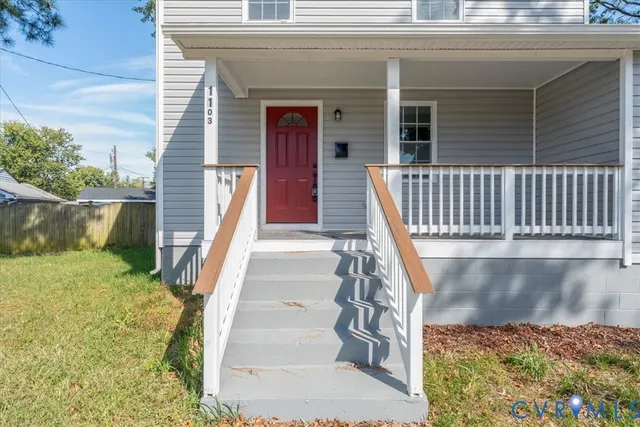 a view of a balcony with wooden floor and fence