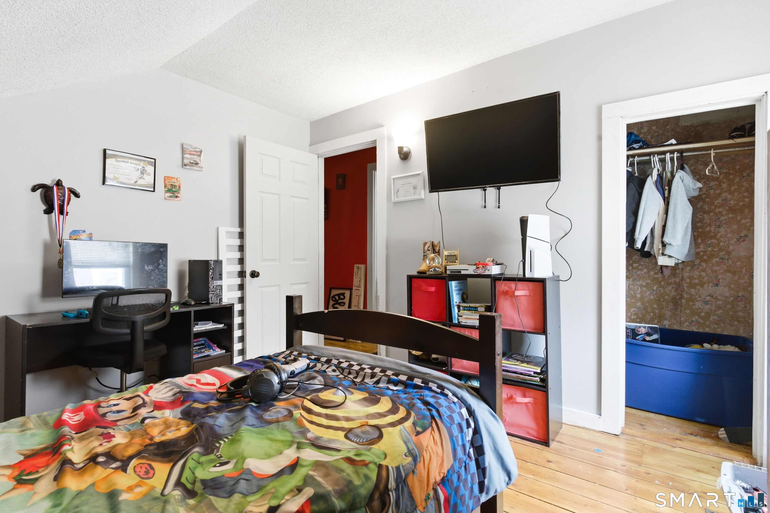 36 Church Street Killingly, CT 06241 - Photo 33 of 39 a bedroom with a bed and a flat screen tv