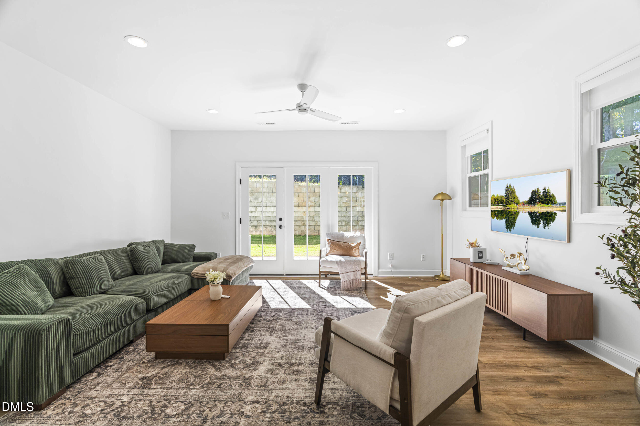 5631 Johnson Woods Court Raleigh, NC 27609 - Photo 11 of 34 a living room with furniture and a large window