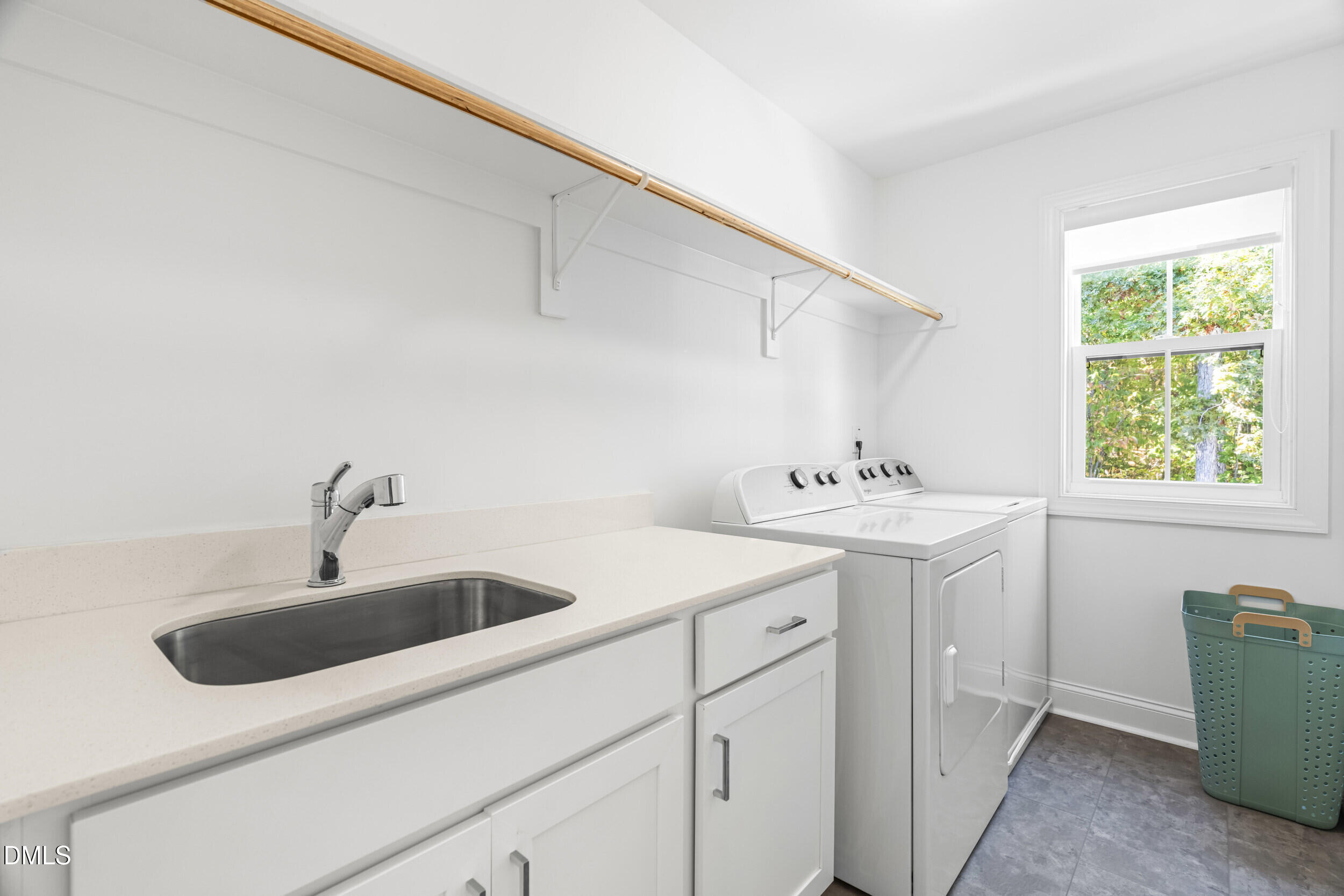 5631 Johnson Woods Court Raleigh, NC 27609 - Photo 22 of 34 a bathroom with a sink and a window