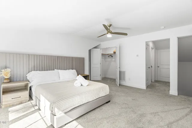 a bathroom with a sink a toilet and shower curtain