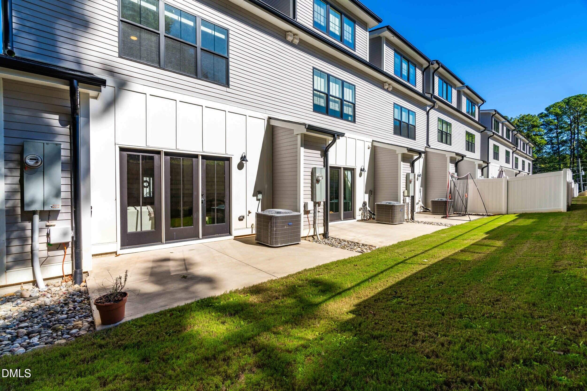 5631 Johnson Woods Court Raleigh, NC 27609 - Photo 28 of 34 a view of a house with a yard and plants