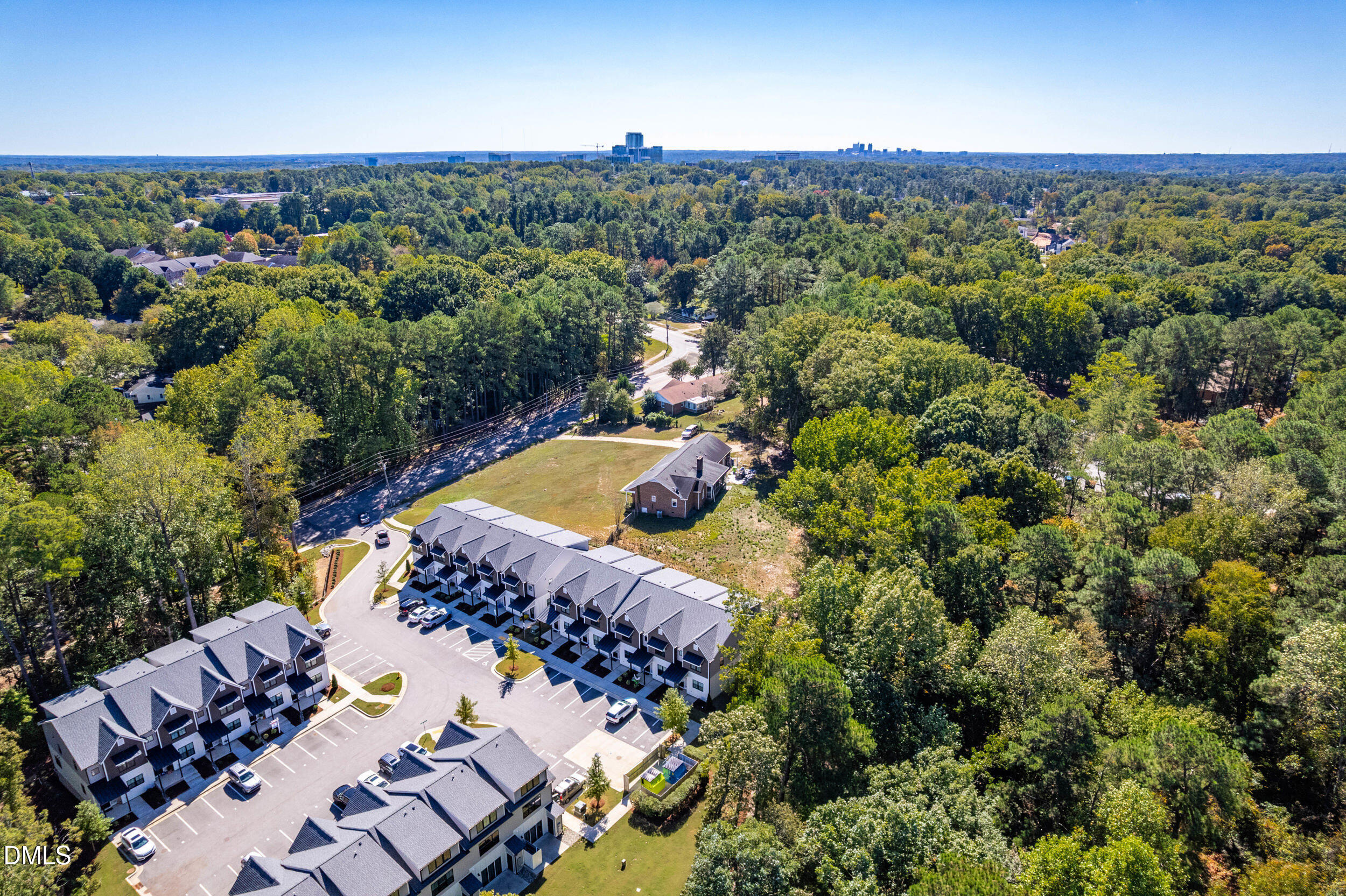 5631 Johnson Woods Court Raleigh, NC 27609 - Photo 31 of 34 an aerial view of a house with a yard