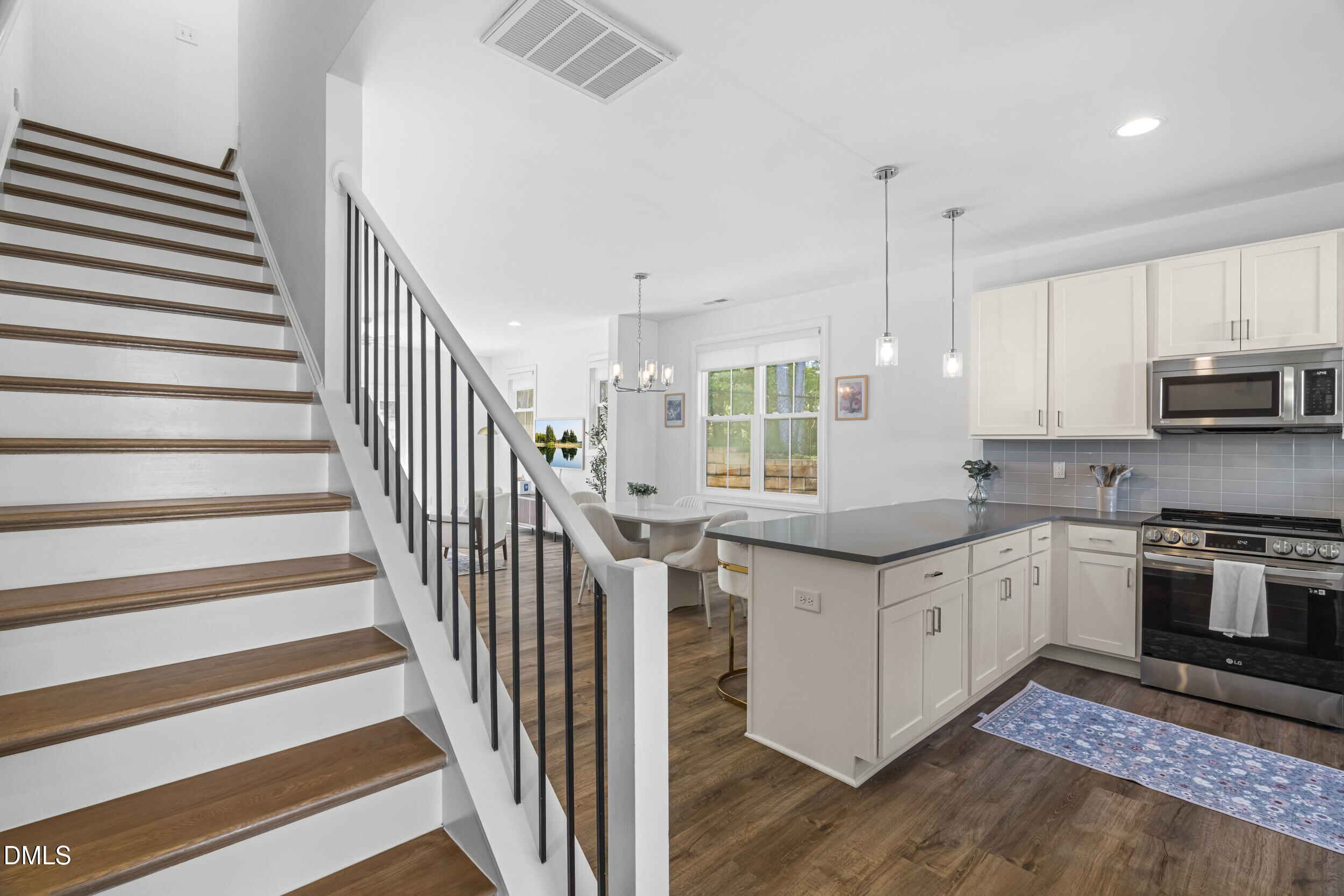 5631 Johnson Woods Court Raleigh, NC 27609 - Photo 4 of 34 a kitchen with stainless steel appliances granite countertop a stove and a sink