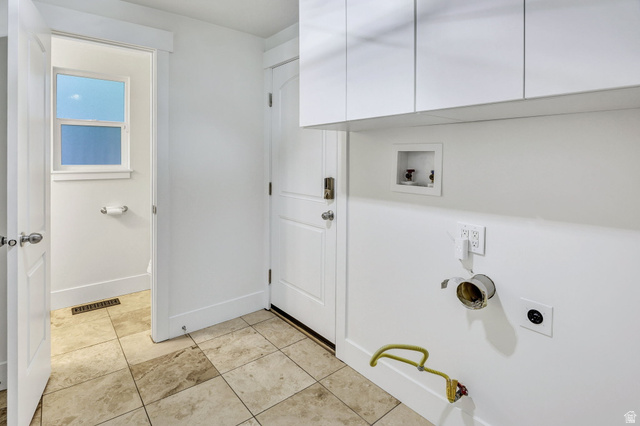 1320 Canyon Park Road Bountiful, UT 84010 - Photo 17 of 28 Laundry area featuring hookup for a washing machine, cabinet space, light tile patterned flooring, and hookup for an electric dryer