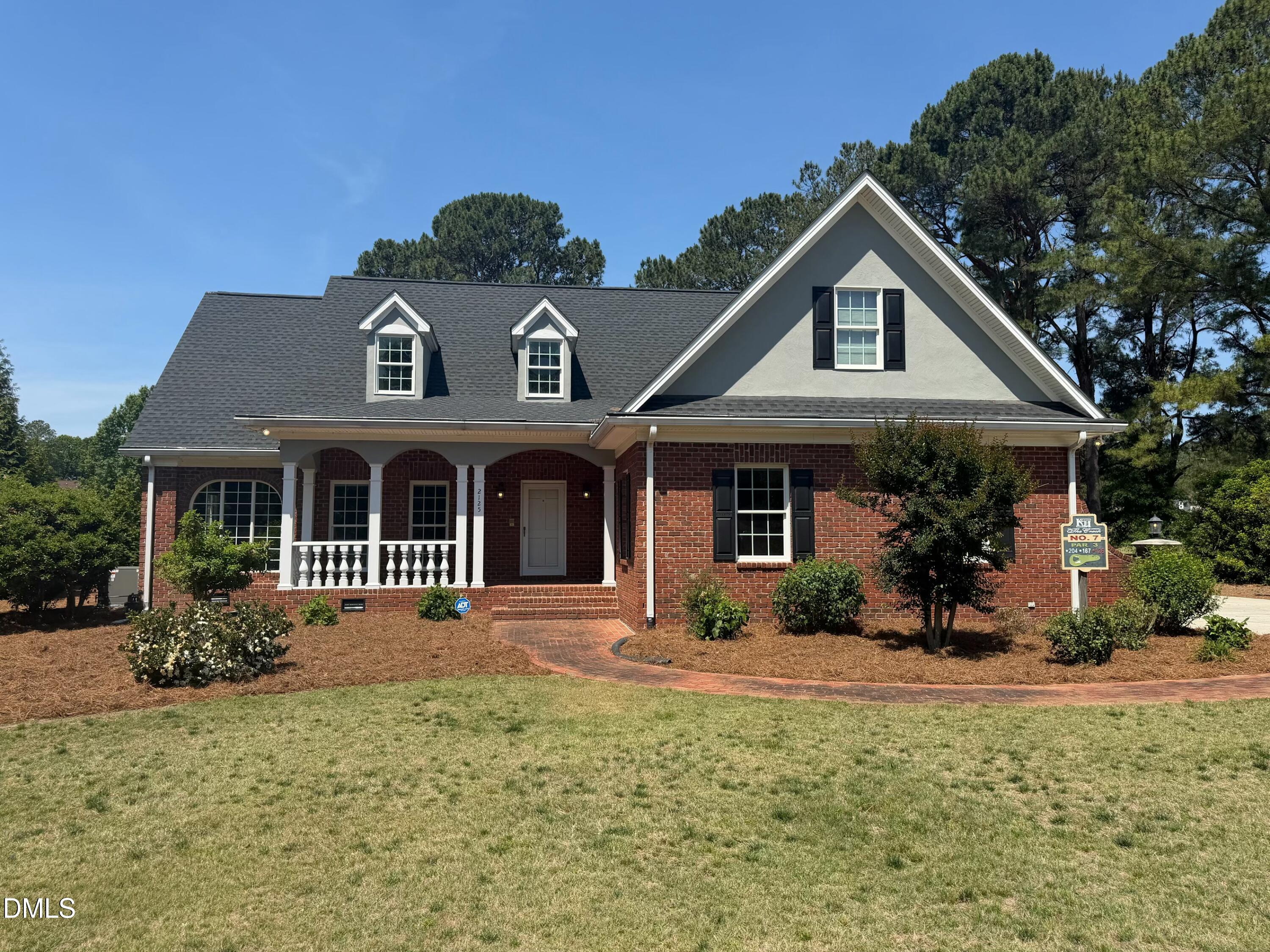 2125 Keith Hills Road Lillington, NC 27546 - Photo 1 of 66 a front view of a house with a yard