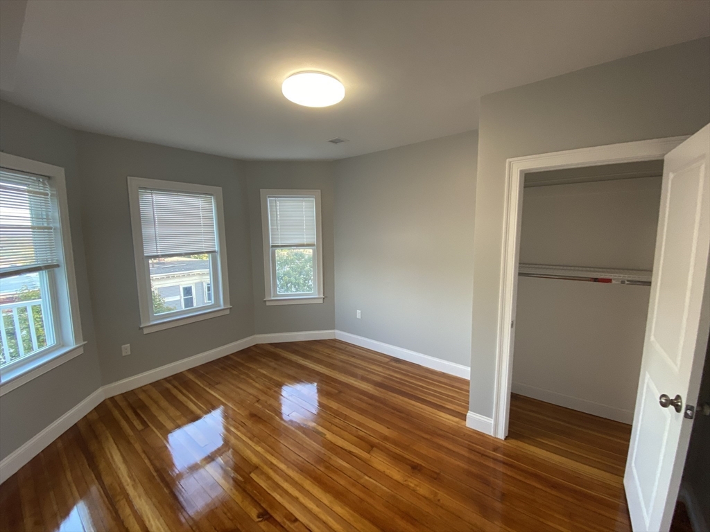 27 Juliette Street Boston, MA 02122 - Photo 12 of 37 a view of an empty room window and wooden floor