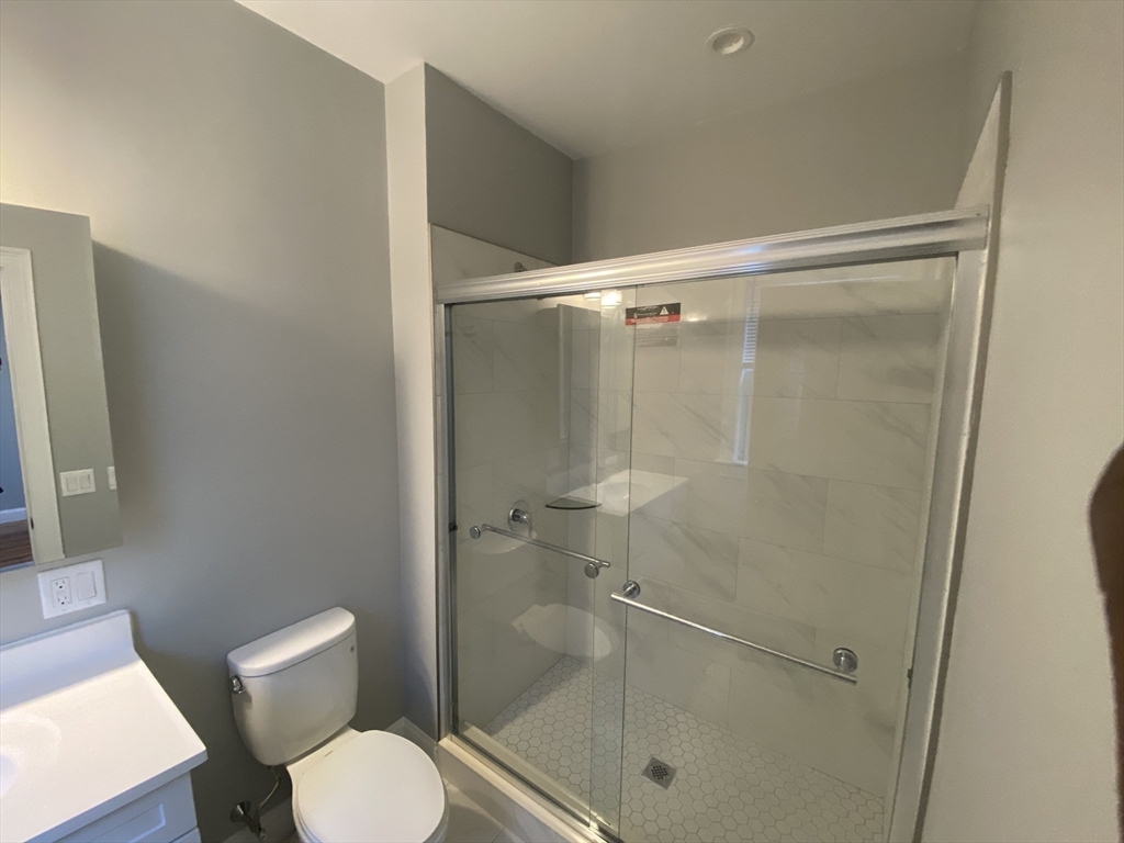 27 Juliette Street Boston, MA 02122 - Photo 13 of 37 a bathroom with a shower and toilet