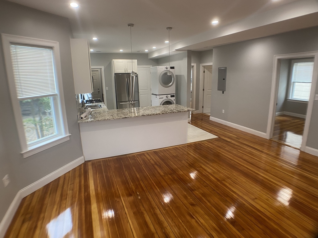27 Juliette Street Boston, MA 02122 - Photo 19 of 37 a view of kitchen with cabinets and wooden floor