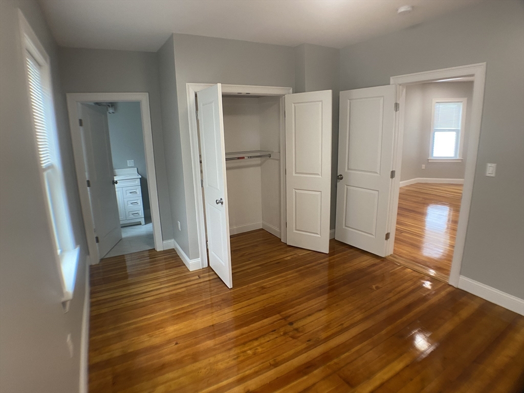 27 Juliette Street Boston, MA 02122 - Photo 21 of 37 a view of empty room with wooden floor