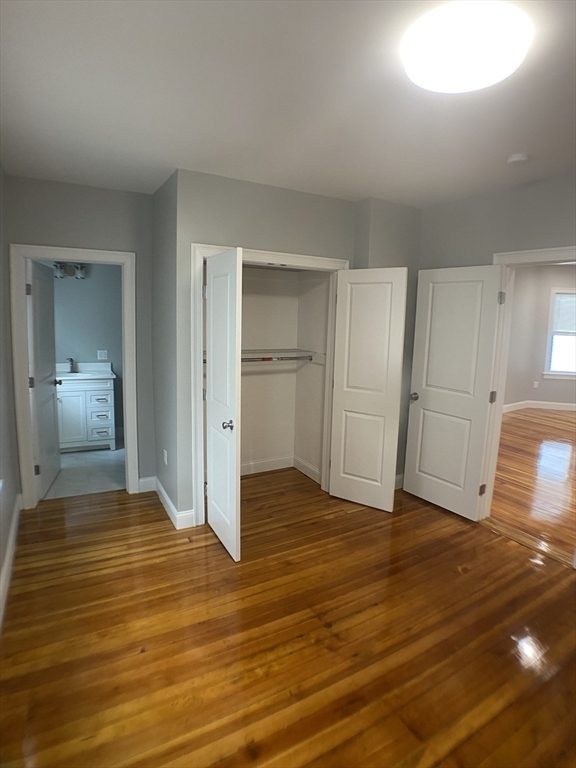 27 Juliette Street Boston, MA 02122 - Photo 24 of 37 a view of empty room with wooden floor