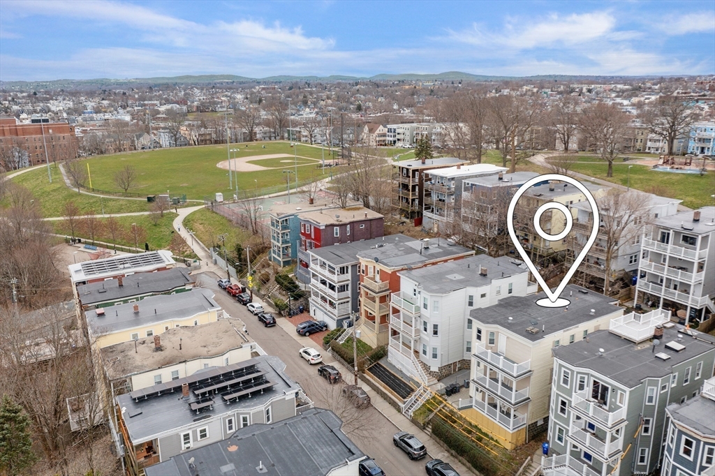 27 Juliette Street Boston, MA 02122 - Photo 3 of 37 an aerial view of a city with lawn chairs