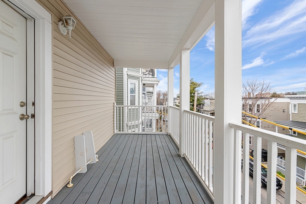 27 Juliette Street Boston, MA 02122 - Photo 35 of 37 a view of a balcony with wooden floor