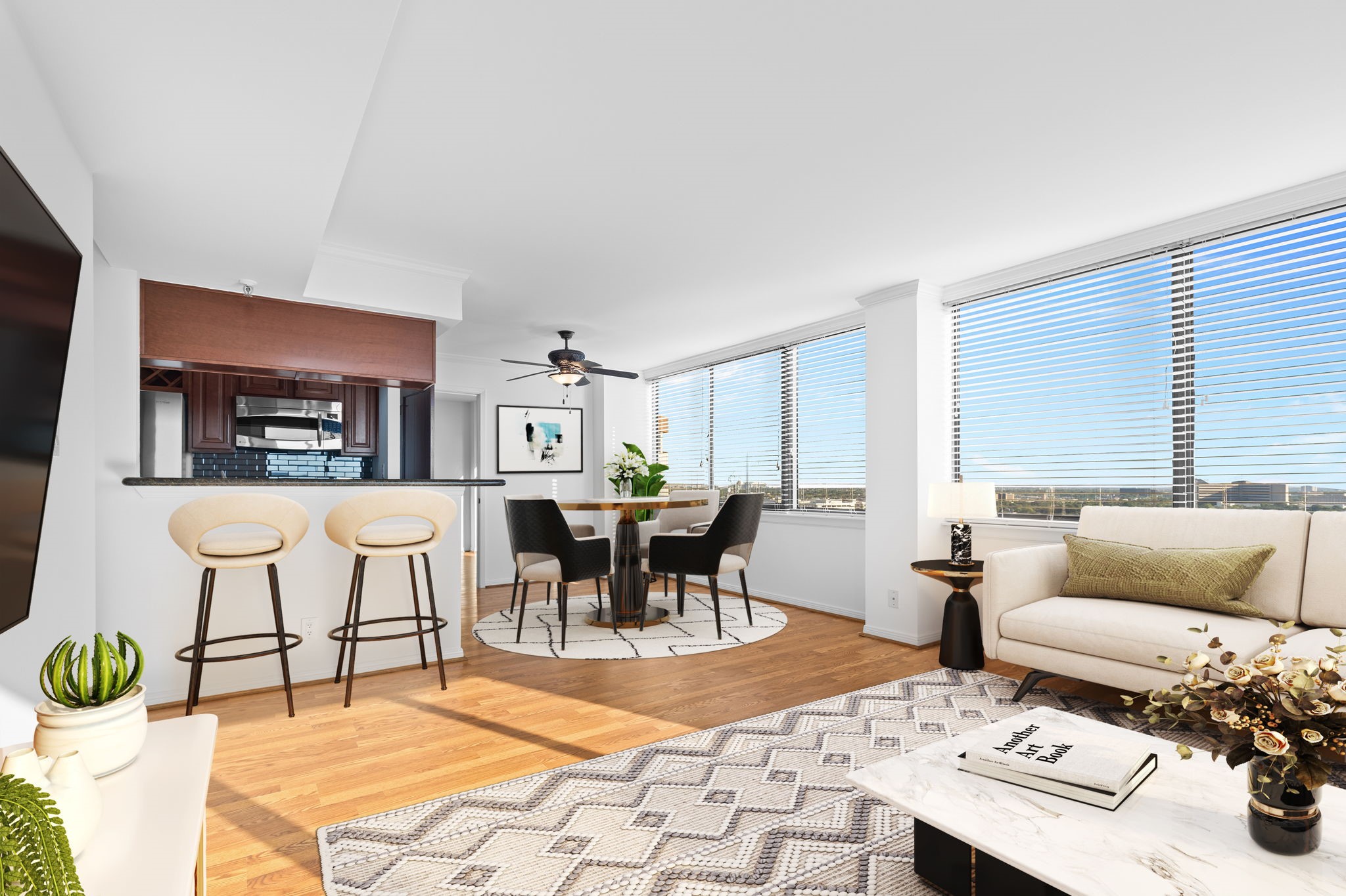 a living room with furniture a rug and a table