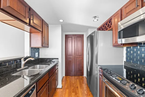a kitchen that has a sink and a stove
