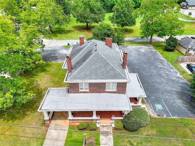 an aerial view of a house with a garden space