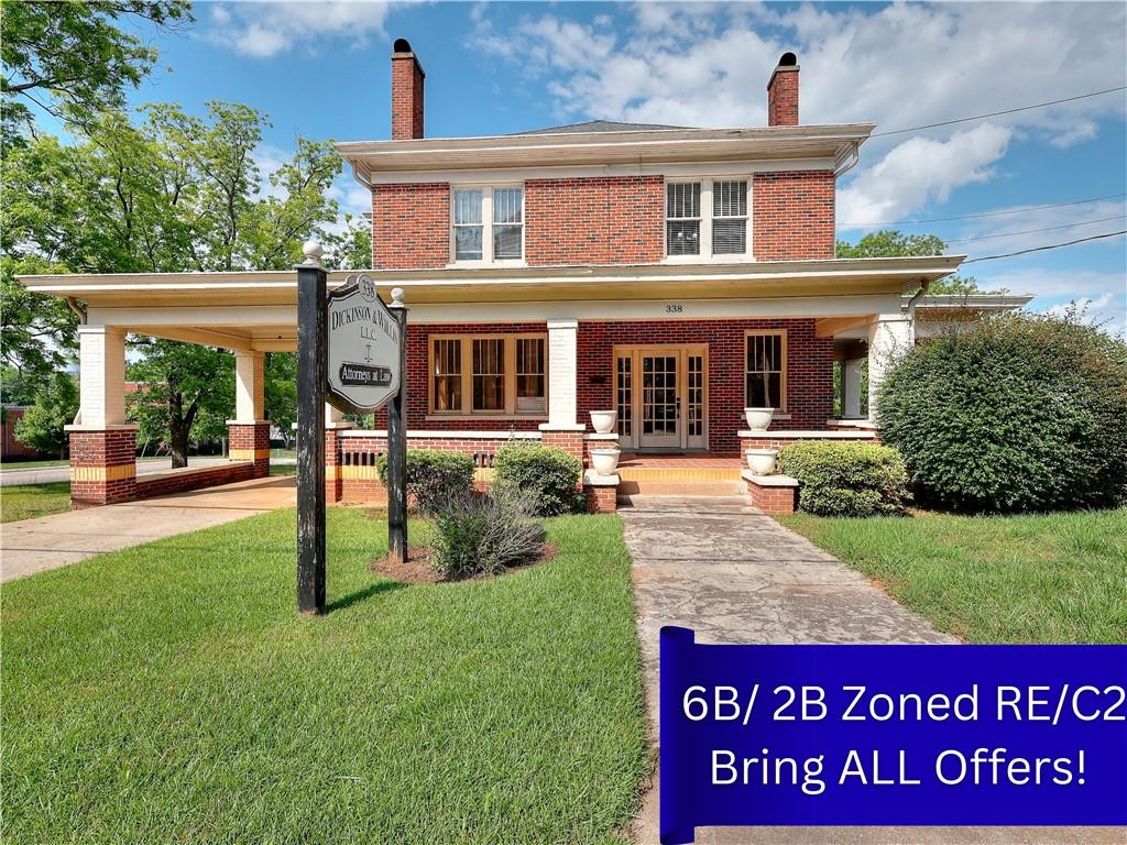 338 North Broad Street Monroe, GA 30655 - Photo 3 of 67 a front view of a house with garden