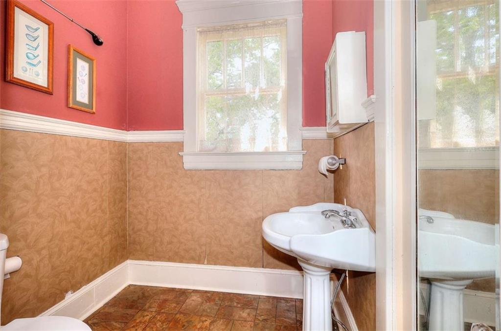 338 North Broad Street Monroe, GA 30655 - Photo 31 of 67 a bathroom with a sink toilet and shower