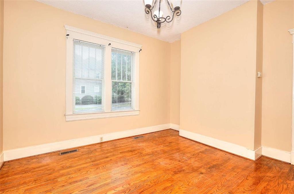 338 North Broad Street Monroe, GA 30655 - Photo 35 of 67 a view of empty room with wooden floor and fan
