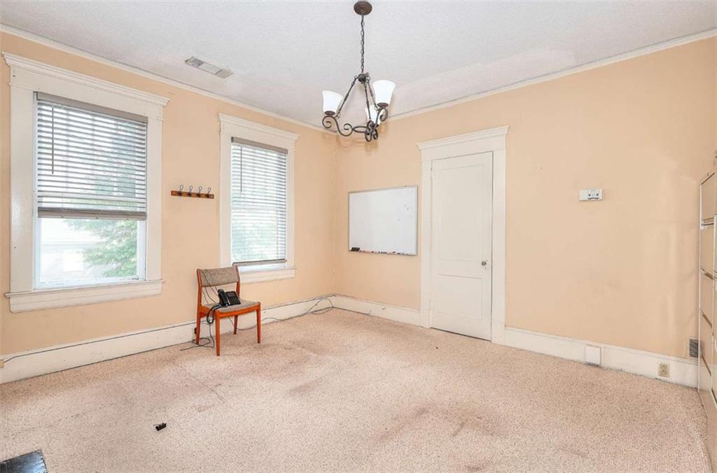 338 North Broad Street Monroe, GA 30655 - Photo 41 of 67 a view of an empty room with a window