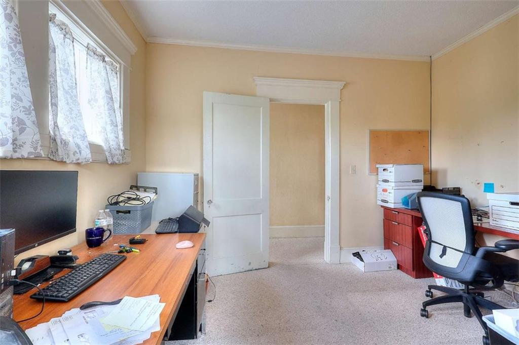 338 North Broad Street Monroe, GA 30655 - Photo 47 of 67 a room with furniture and a window