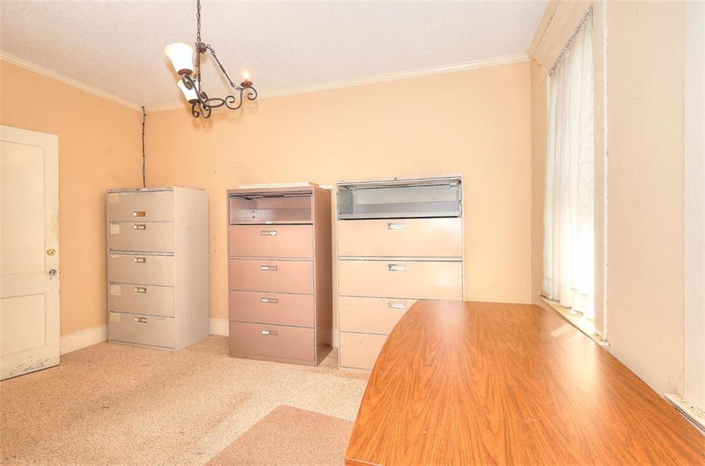 338 North Broad Street Monroe, GA 30655 - Photo 49 of 67 a bedroom with a bed and cabinets