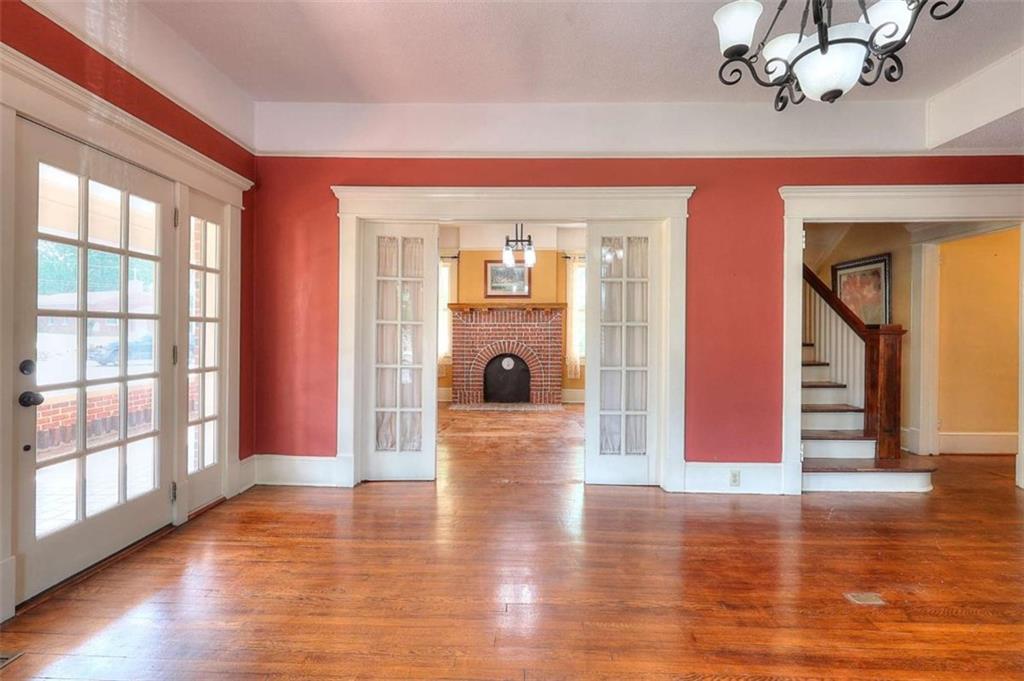 338 North Broad Street Monroe, GA 30655 - Photo 8 of 67 a view of a livingroom with wooden floor and furniture