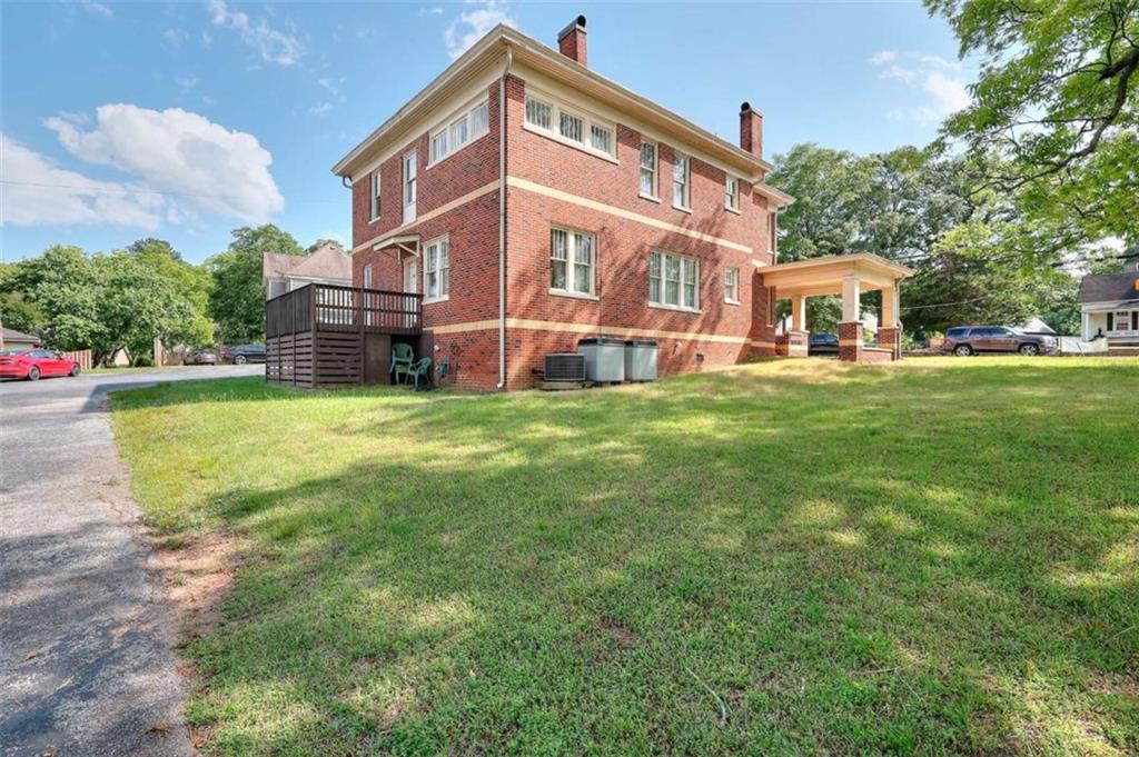 338 North Broad Street Monroe, GA 30655 - Photo 9 of 67 a view of a house with a big yard