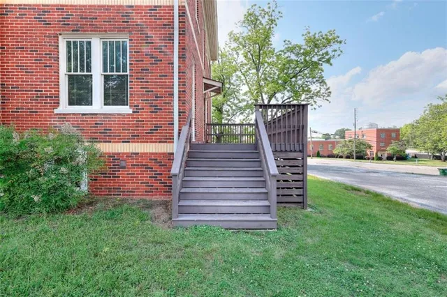 a view of a chairs in the backyard of the house