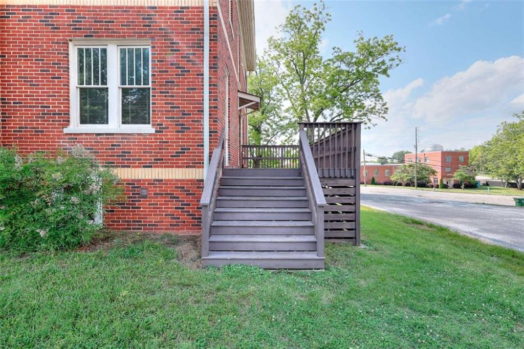 338 North Broad Street Monroe, GA 30655 - Photo 10 of 67 a view of a chairs in the backyard of the house