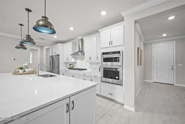 a living room with furniture ceiling fan and a rug