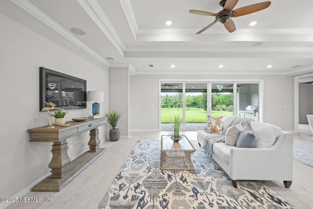 a bedroom with a bed and a ceiling fan