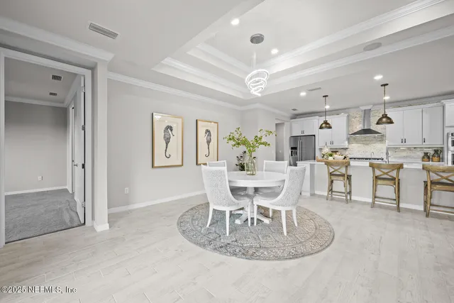 a view of a livingroom with a ceiling fan and window