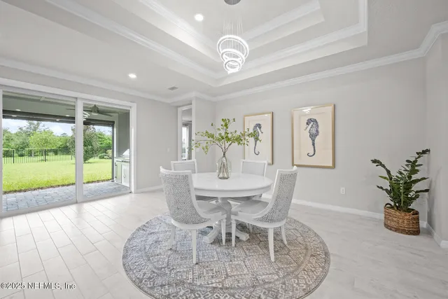 a view of an empty room with a fireplace and a window