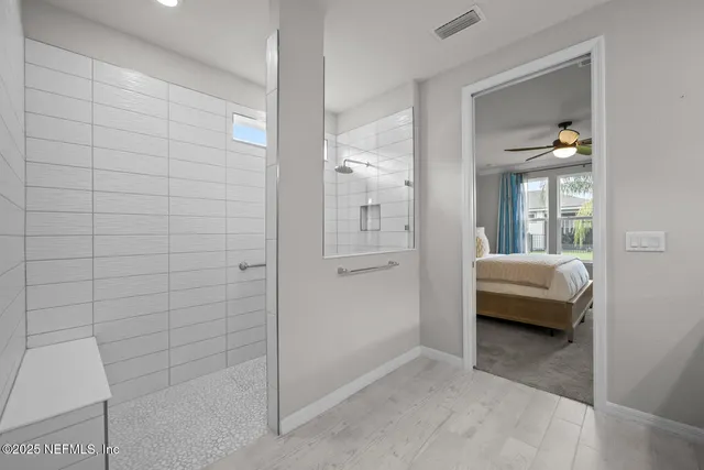 a view of a house with a yard potted plants and a fountain