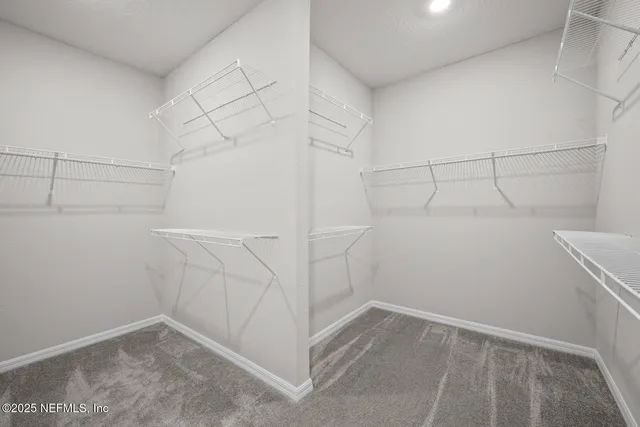 a view of a swimming pool with a patio and a garden