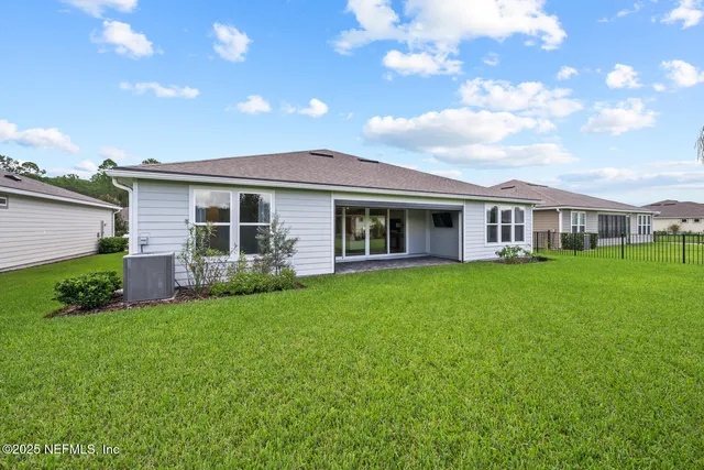 a view of a patio with a dining table and chairs with a fire pit