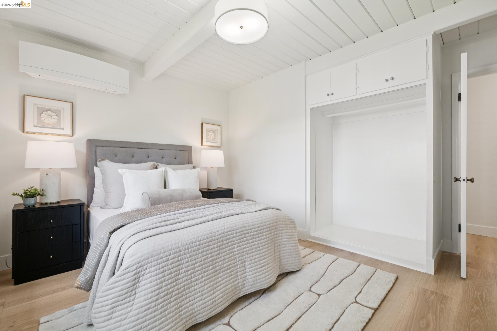1321 Sunset Loop Lafayette, CA 94549 - Photo 21 of 49 Vaulted wood-paneled ceiling, light wood-finish flooring, built-in wardrobe with upper cabinetry, and a ceiling-mounted light fixture