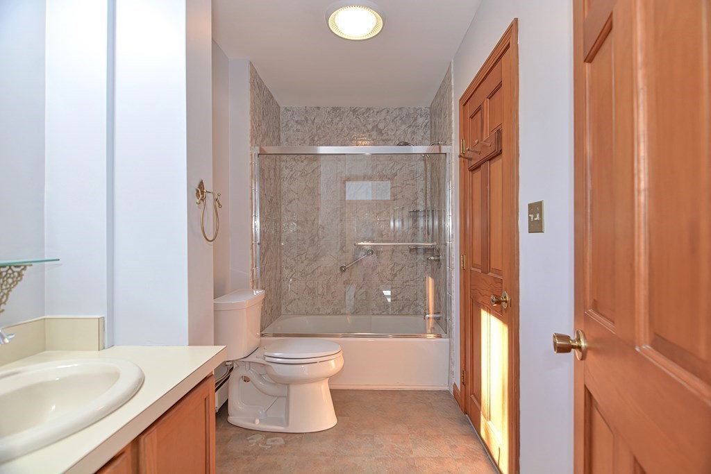 88 Townsend Road, Unit A Shirley, MA 01464 - Photo 18 of 35 a bathroom with a granite countertop sink toilet and shower