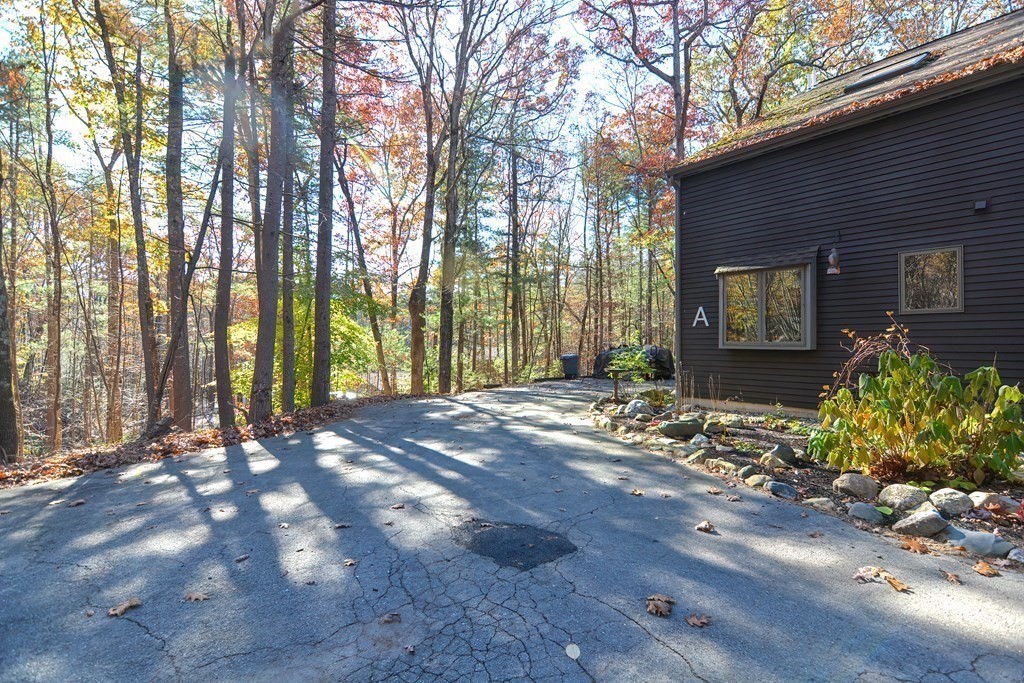 88 Townsend Road, Unit A Shirley, MA 01464 - Photo 34 of 35 a view of entrance gate of house and trees in the background
