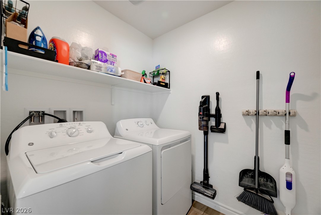 7204 North Decatur Boulevard, Unit 3 North Las Vegas, NV 89084 - Photo 33 of 48 Functional laundry space featuring a practical shelf for organization.