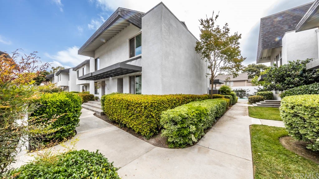 12585 Cluster Pines Road Garden Grove, CA 92845 - Photo 1 of 1 a view of a house with a yard and potted plants