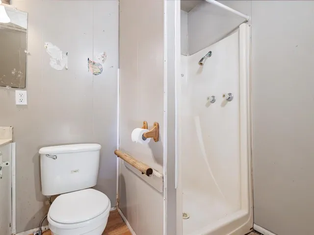 a white toilet sitting next to a bathroom sink