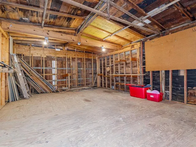 a view of a room with wooden walls