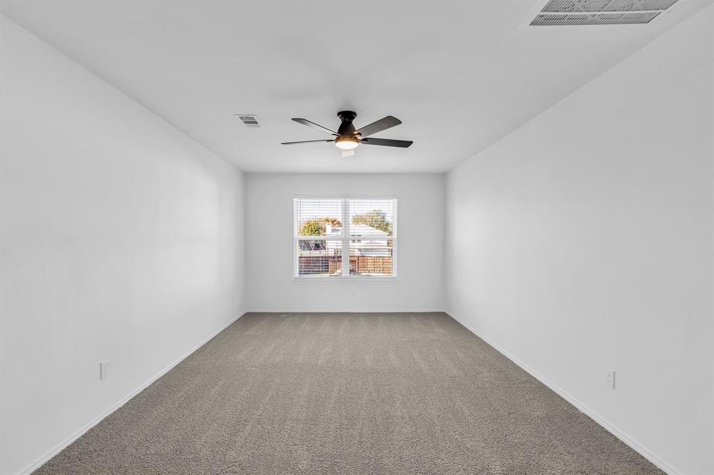 906 Thistle Circle Allen, TX 75002 - Photo 30 of 40 wooden floor in an empty room with a window