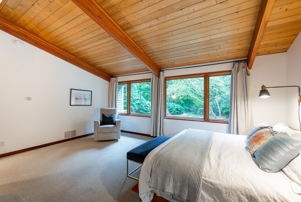 12 Rice Spring Lane Wayland, MA 01778 - Photo 17 of 37 a bedroom with a bed and a large window