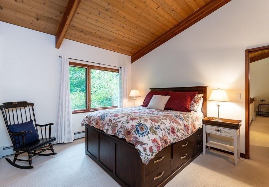 12 Rice Spring Lane Wayland, MA 01778 - Photo 23 of 37 a bedroom with a bed chair and window
