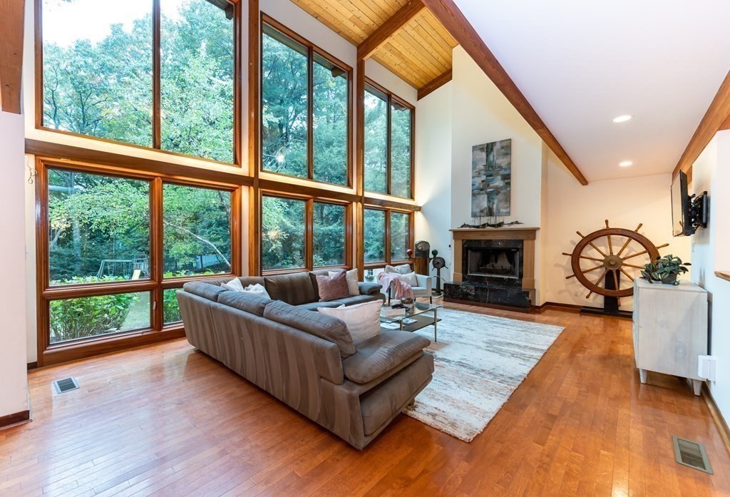 12 Rice Spring Lane Wayland, MA 01778 - Photo 5 of 37 a living room with furniture and a fireplace