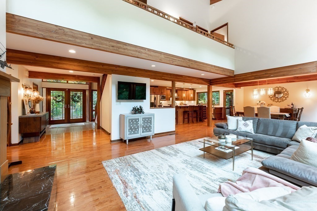 12 Rice Spring Lane Wayland, MA 01778 - Photo 7 of 37 a dining room with furniture and wooden floor
