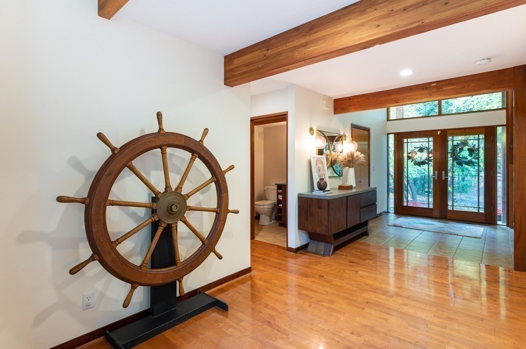 12 Rice Spring Lane Wayland, MA 01778 - Photo 10 of 37 a living room with furniture and a large window